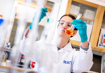 Laboratory technician testing liquid